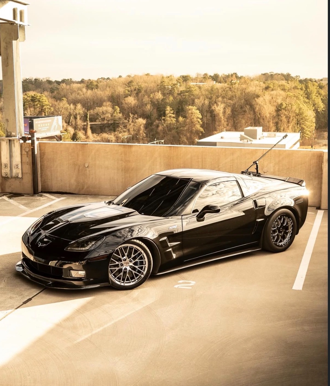 Black Corvette ZR1 on rooftop parking deck photoshoot