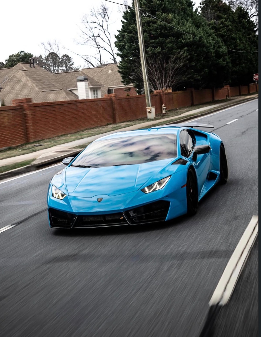 Blue Lamborghini Huracan rolling shot on Atlanta street