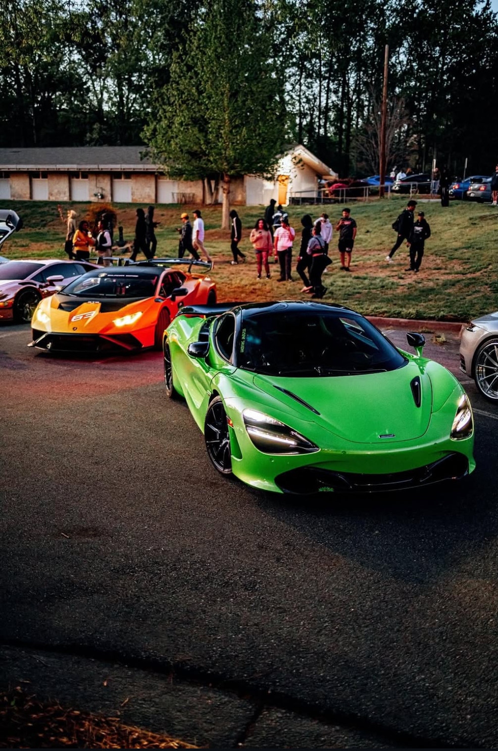 Green McLaren and Lamborghini Huracan lineup at community car event